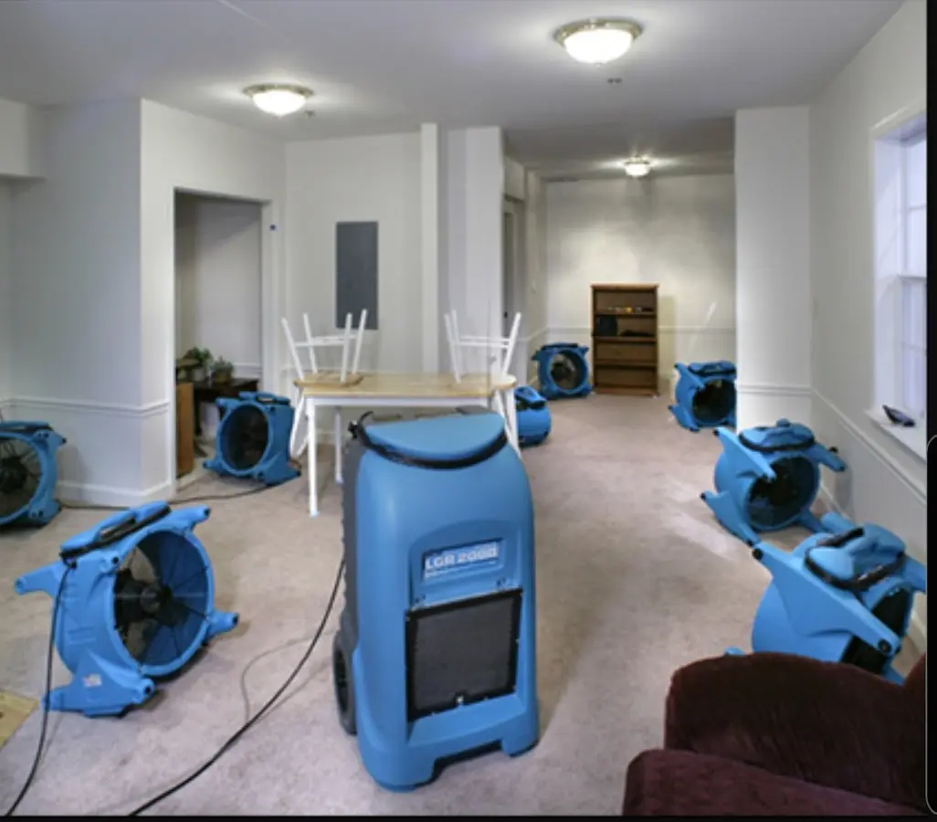 Air movers and dehumidifier setup for Water Damage Restoration in North Liberty