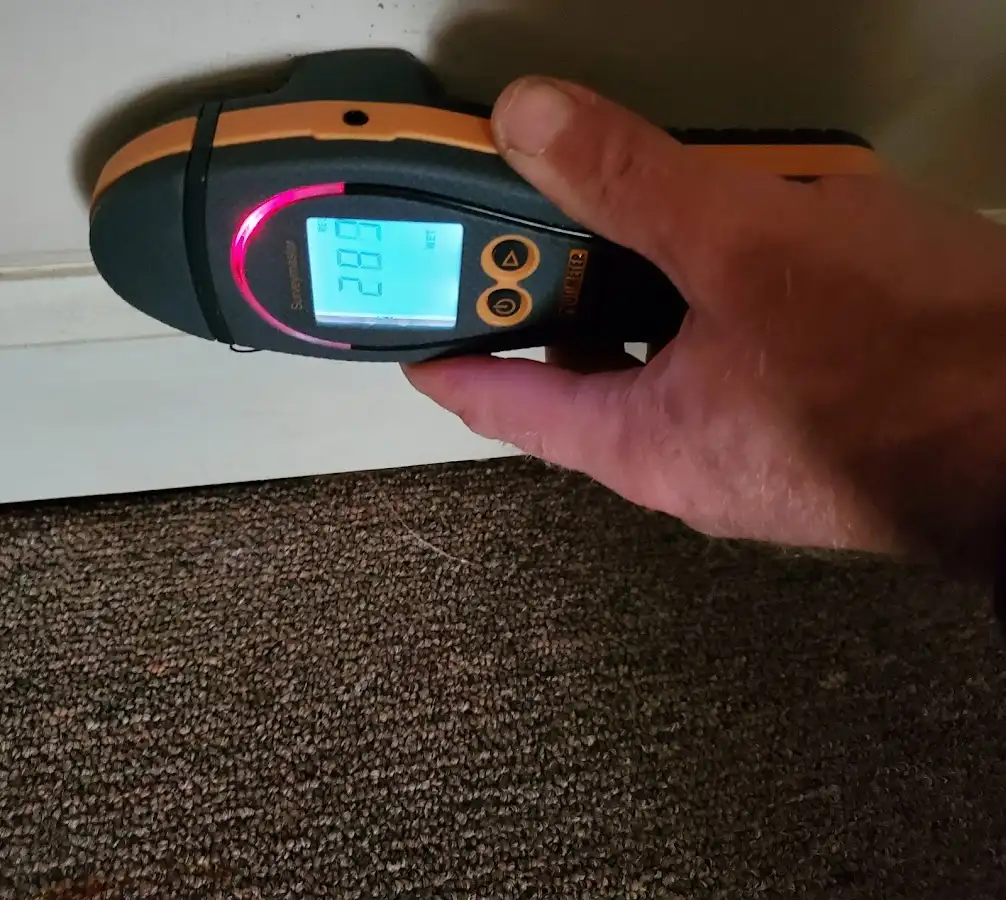 Moisture detection at baseboard during Sewage Cleanup & Sanitation in North Liberty